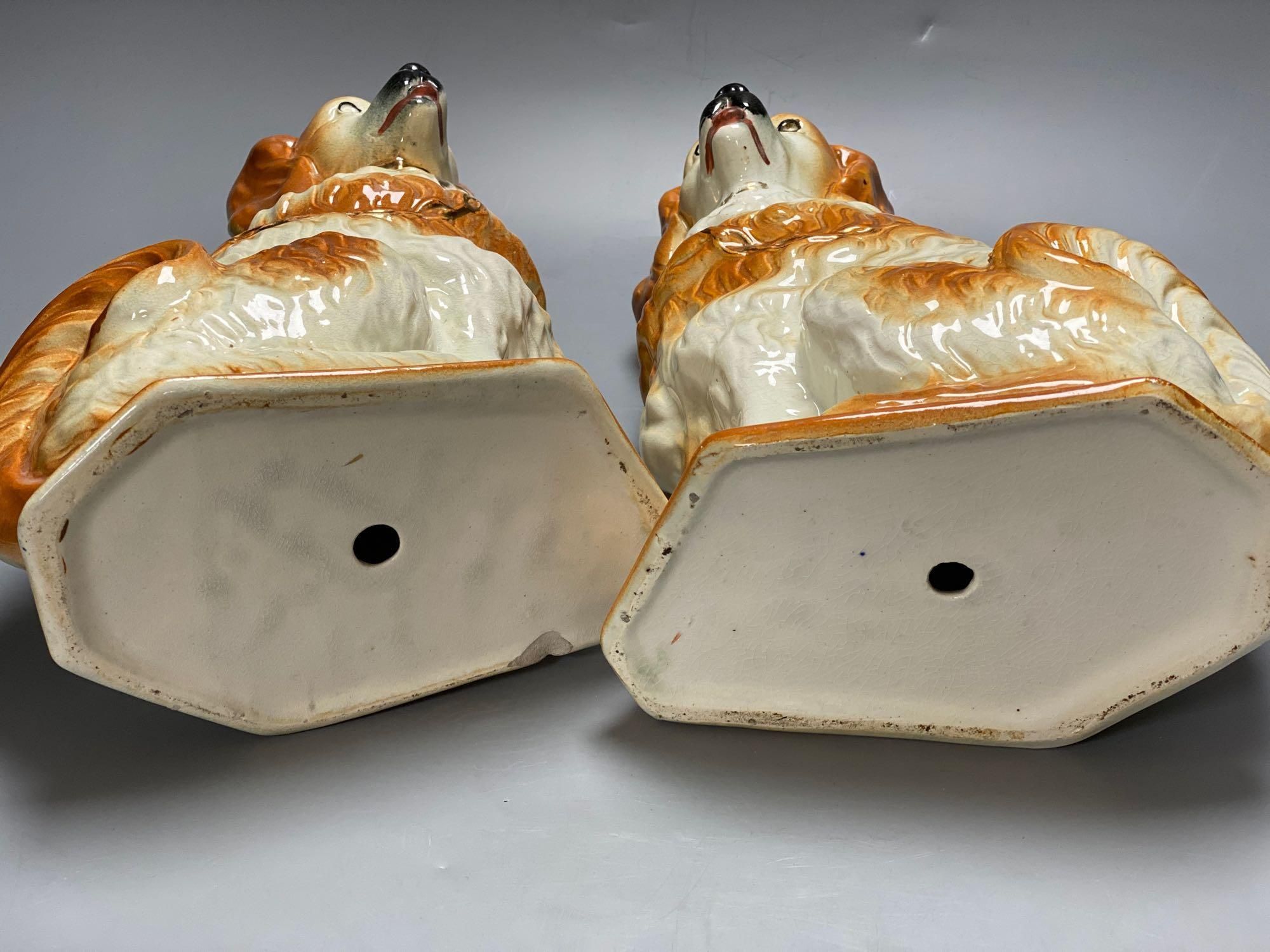 A pair of modern Staffordshire pottery dogs, 33cm